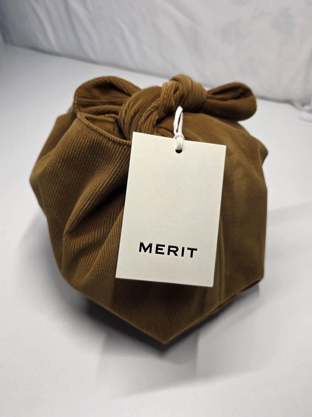 MERIT Travel Wrap Bag in Caramel Brown